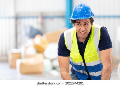 engineer man or factory worker feeling tired for hardworking in warehouse storage - Shutterstock ID 2022944201