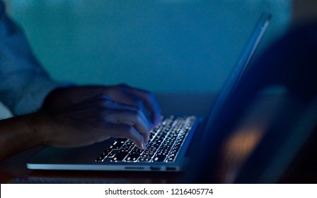 engineer man hand type keyboard input configuration data ode for register system structure or unlock password on laptop in dark operation office room for cyber security and safety technology concept