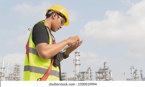 Engineer man talking telephone, Businessman working on construction building Oil refinery background