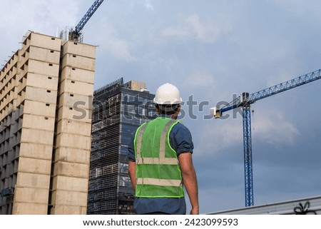 Engineer man working and looking construction site