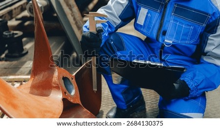 Engineer measuring propeller in shipyard for cargo industry maintenance, Technical Control concept.
