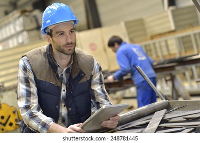 Engineer In Metallurgical Factory Using Tablet