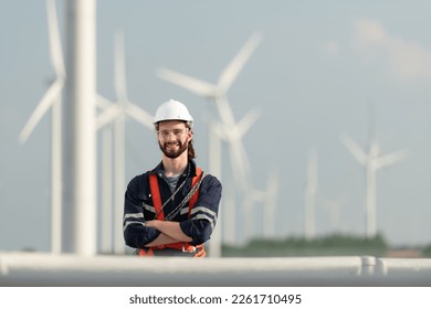 Engineer at Natural Energy Wind Turbine site with a mission to climb up to the wind turbine blades to inspect the operation of large wind turbines that converts wind energy into electrical energy - Shutterstock ID 2261710495