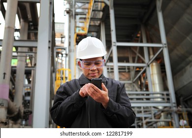 engineer oil refinery communicate via mobile phone