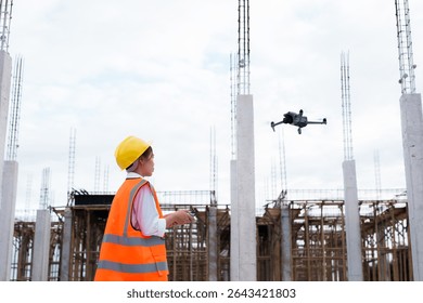 Engineer operating drone at construction site for industrial inspection and surveillance, ensuring safety, power infrastructure development, and environmental monitoring with advanced remote control t