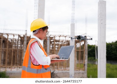 Engineer operating drone at construction site for industrial inspection and surveillance, ensuring safety, power infrastructure development, and environmental monitoring with advanced remote control t