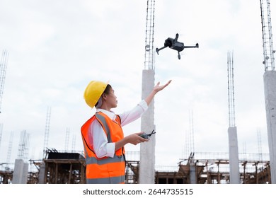 Engineer operating drone at construction site for industrial inspection and surveillance, ensuring safety, power infrastructure development, and environmental monitoring with advanced remote control t - Powered by Shutterstock - Get 15% off with code: PIKWIZARD15