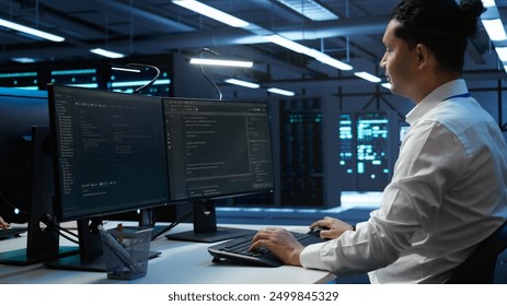 Engineer overseeing data center, making routine improvements and updates to ensure system can handle all networking tasks. Server room employee tracking network traffic and activity, camera B