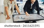 Engineer, people and hands with world map on screen for turbine location, power development and data analysis. Interactive display, teamwork and employee pointing to chart area for site selection