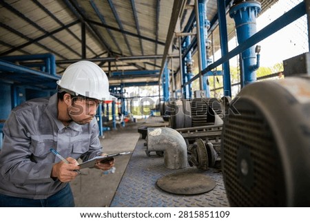 Engineer Performing Preventive Maintenance on Industrial Pump System in Water Treatment Plant