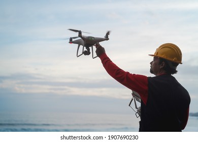 Engineer pilot man holding drone before flight - Focus on hand