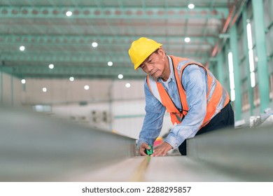 Engineer with plan under checking the industry . Professional engineering and manager, logistic worker warehouse, check in factory, warehouse Workshop for factory operators.