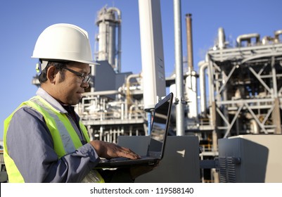 Engineer Power And Energy Using Laptop On Location Site