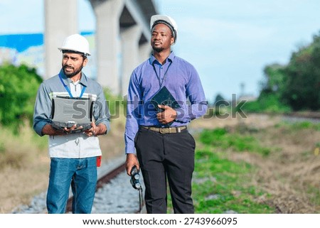 Engineer presents railway development proposal to investor during site visit, discussing green initiatives, future expansion, regional growth, Professional collaboration, stakeholder engagement