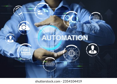 Engineer or programmer is setting up automation work in industrial or factory system command writing program to control operation of machine and robot, monitoring with smartphone and cloud computing.