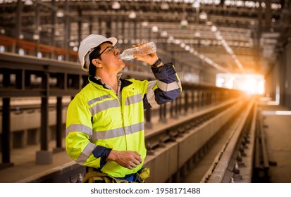 Engineer Railway Drinking Water Between Inspection And Checking Construction Process Train Work Shop And Railroad Station .Engineer Wearing Safety Uniform And Helmet In Work