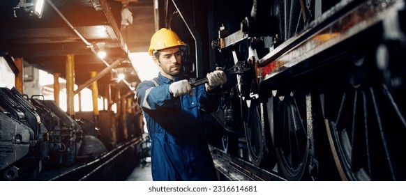 Engineer railway wearing safety uniform and helmet under checking under train ,wheels and control system for safety travel passenger. Banner cover design. - Powered by Shutterstock