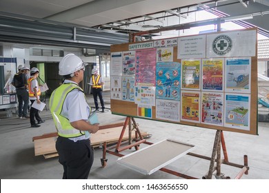 The Engineer Reading Notice Board Of Safety Policy Before Working In Construction Site In Bangkok Thailand On 25 March 2019. Selective Focus