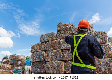 Engineer and Recyclable material. An engineer looking at recycling waste To proceed to the next process. Foreman wearing protective equipments and holding tablet and looking at Recyclable material. - Powered by Shutterstock