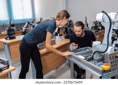 An engineer in research development robotic factory checking prototype of automation robot arm
