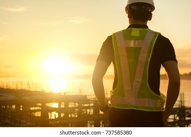 Engineer or Safety officer holding hard hat  in construction site. - Shutterstock ID 737585380