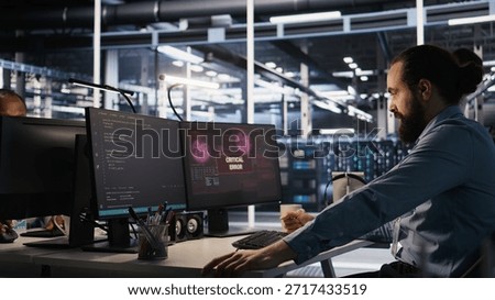 Engineer in server hub dealing with unexpected system error alert, showing signs of fatigue and irritation. Data center IT professional attempt multiple fixes after repeated failure warnings, camera A
