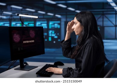 Engineer in server hub frightened by hacking attack on computers targeting sensitive user data. Afraid woman panicking, trying to save data center from unauthorized access