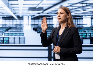 Engineer in server hub using AR technology checking hardware after installing storage units. Data center worker using augmented reality to do maintenance after replacing mainframes components