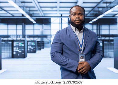 Engineer in server room implementing and maintaining security measures to protect data and systems from unauthorized access or cyber threats. Data center employee doing hardware installation - Powered by Shutterstock - Get 15% off with code: PIKWIZARD15