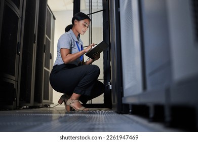 Engineer, server room and woman with tablet for database connection cable, maintenance or software update at night. Cybersecurity, it and female coder with technology for networking in data center. - Powered by Shutterstock