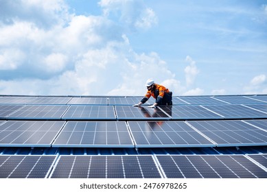 Engineer service check installation solar cell on the roof of factory , Sustainable energy industry concept, Renewable energy solution for climate change