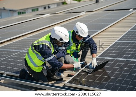 Engineer service check installation solar cell on the roof of factory. technician checks the maintenance of the solar panels, engineering team working on checking and maintenance in solar power plant