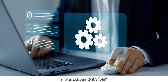 Engineer setting up automated software.Automated industrial technology with digital transformation.Business process optimisation.Robotic process automation or RPA.