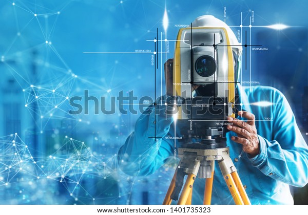 engineer site survey with laser tripod machine\
in site construction\
background