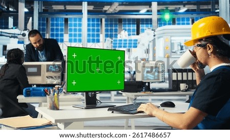 Engineer in solar panels plant using CAD software on mockup PC to optimize layouts. Photovoltaics factory worker using green screen computer to do arrangements for maximum energy output, camera A