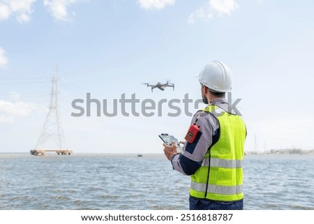 Engineer Specialists Pilot Drone on Construction Site. Architectural Engineer and Safety Engineering Inspector Fly Drone at industrial plant.
