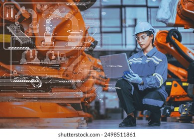 Engineer Staff Using Laptop Computer Technology Software Program Robot In Robotic Industry Factory overlay modern graphics HUD.