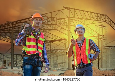 Engineer standing over the construction site