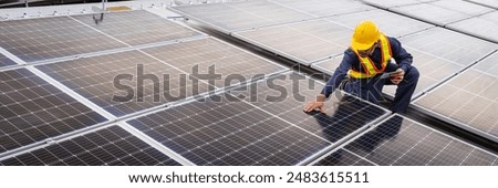 An engineer stands on a modern rooftop, inspecting an array of solar panels. The setting sun casts a warm glow, highlighting the commitment to renewable energy and technological advancement.