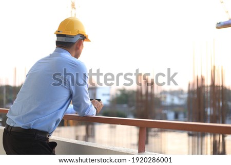 The engineer stood looking at the construction project that was beginning to take place.