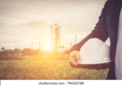 Engineer Suit White Helmet For Security Standing Against Oil Refinery Plant In Heavy Petrochemical Industry Estate 