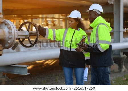 Engineer survey team checking construction project inspection work construction site .Team Civil engineer working outdoor next to the power plant.