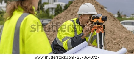 Engineer survey team checking construction project  inspection work construction site .Team Civil engineer working outdoor next to the power plant.