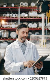 Engineer With Tablet Working At Polymer Factory