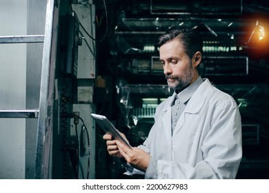 Engineer With Tablet Working At Polymer Factory