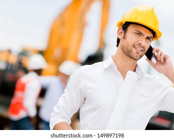 Engineer talking on the phone on a construction site 