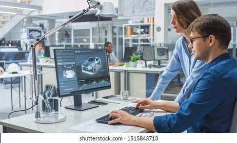 Engineer Talking With Project Manager and Working on Desktop Computer Using CAD Software with Technical Drawings on the Screen. In the Background Engineering Facility Specialising on Industrial Design - Shutterstock ID 1515843713