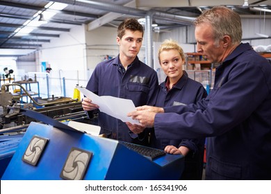 Engineer Teaching Apprentices To Use Tube Bending Machine