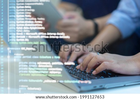 Engineer team of programmer employee type command laptop to input code language into software for build application or network system at office for business and network development technology concept