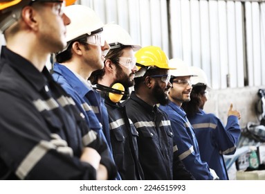 engineer team standing at industry  - Shutterstock ID 2246515993